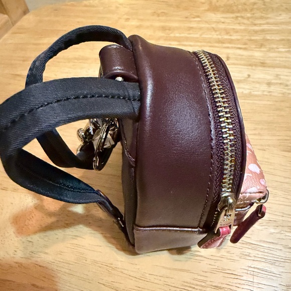 coach backpack coin case Strawberry Printed coated canvas and smooth leather Zip closure fabric lining Outside zip pocket Attached split key ring and dogleash clip 3 1/4 (L) x 4 (H) x 1 1/2 (W) Style No. I Wore the Biggest Coach